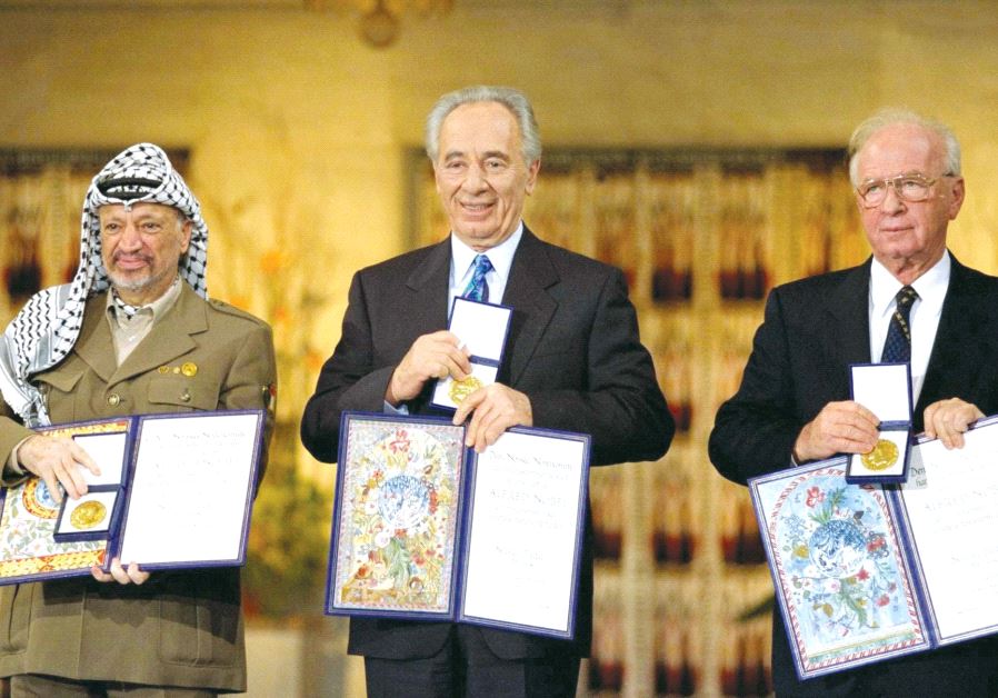 Shimon Peres receives the Nobel Peace Prize in Oslo, Norway, in 1994 alongside Yitzhak Rabin and Yasser Arafat (GPO)
