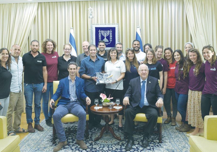 President Reuven Rivlin poses with managers of Ayalim at the President’s Residence (AMOS BEN GERSHOM, GPO)