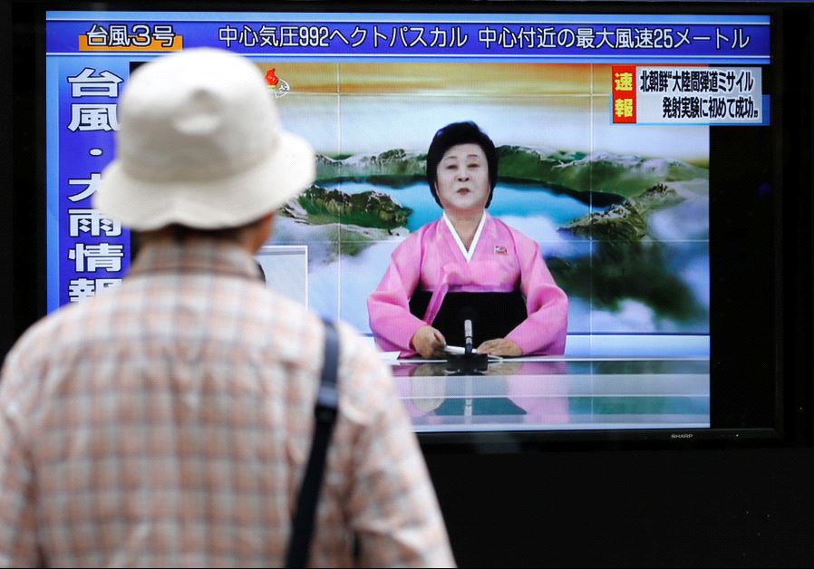A man looks at a TV showing news of North Korea firing a ballistic missile in Tokyo, July 4 2017.(REUTERS/TORU HANAI)