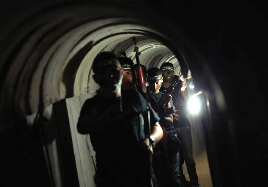 Young Palestinians advance through a tunnel during a military exercise organized by Hamas, east of Gaza City (Reuters)