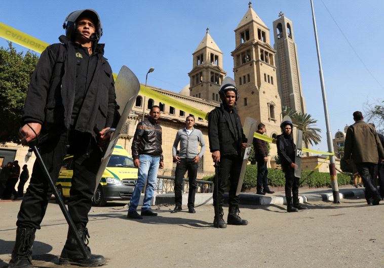 Members of the special police forces stand guard to secure the area around St. Mark's Coptic Orthodox Cathedral after an explosion. Credit: Reuters