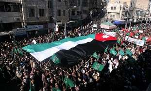 Protesters carry Jordanian flag in Amman