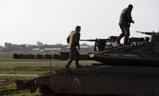 IDF soldiers on tank near Gaza border