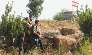Lebanese soldiers patrol the border with Israel