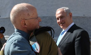 Gilad Schalit hugs father Noam