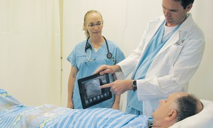 Doctors explain procedure with iPad
