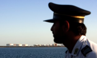 Iranian officer looks at Strait of Hormuz