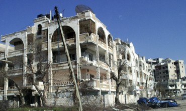 Damaged houses, vehicles in Homs, Syria