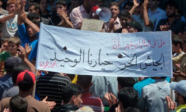 Demonstrators protest against Assad after  prayers