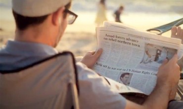 MAN reads a copy of ‘The Jerusalem Post’