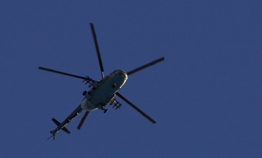 Syrian army helicopter prepares to fire missile