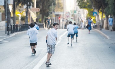 Kids ride scooters on Yom Kippur