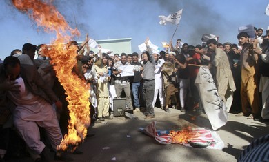 Protesters burn US flag in Afghanistan.