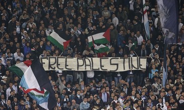 Lazio fans hold banner during Europa League match