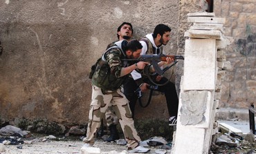 MEMBERS OF A Syrian opposition group are seen on the front lines in Aleppo