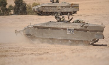 A NAMER APC take part in a live-fire exercise in the Negev.