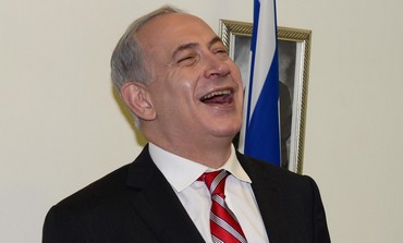 Prime Minister binyamin Netanyahu laughing during a meeting with Swiss FM Didier Burkhalter, May 2.