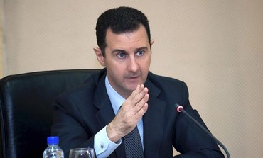 Syrian President Bashar Assad heading a cabinet meeting in Damascus, February 12, 2013.
