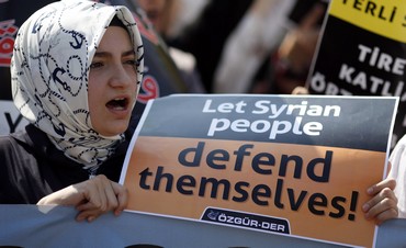 Woman shouts slogans during protest against Assad 