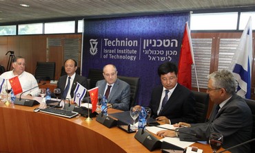 Cninese officials. Techion brass sign agreement for scholarship fund