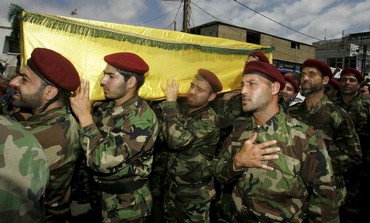 Hezbollah members at funeral of a Hezbollah fighter, May 26, 2013