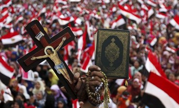 A cross and a Koran at an anti-Morsi protest in Tahrir Square, July 4, 2013.
