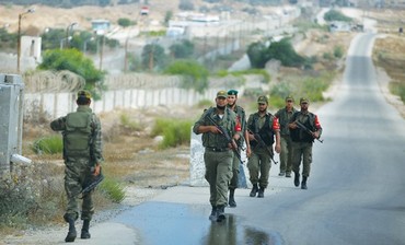 PALESTINIAN SECURITY forces loyal to Hamas patrol the border area between Egypt and southern Gaza.