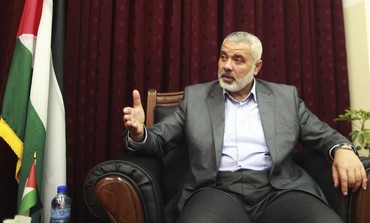 Hamas leader Ismail Haniyeh gestures during an interview with Reuters in Gaza City May 10, 2012. 