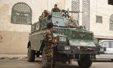 Police troopers secure a street in Sanaa August 5, 2013.