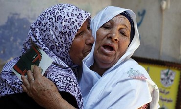 Madre de preso palestino reacciona después de escuchar las noticias sobre la posible liberación de su hijo, julio de 2013.