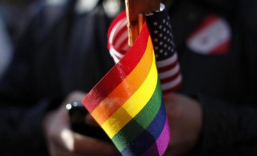 Gay pride and American flags.