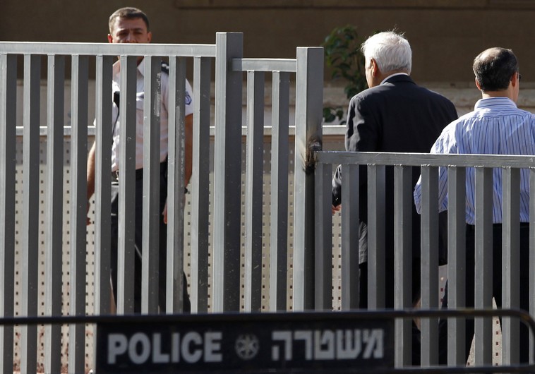 Former Israeli president Moshe Katsav walks towards the entrance to Maasiyahu prison in Ramle, near Tel Aviv, December 7, 2011 (REUTERS)