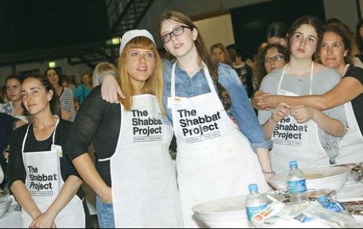 AROUND 2,400 women gather in an inner-Sydney warehouse for a mass bake-off to prepare halla for the 