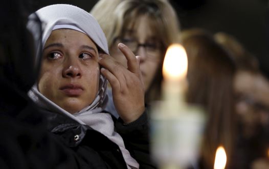 An attendee reflects on the tragedy of Wednesday's attack during a candlelight vigil