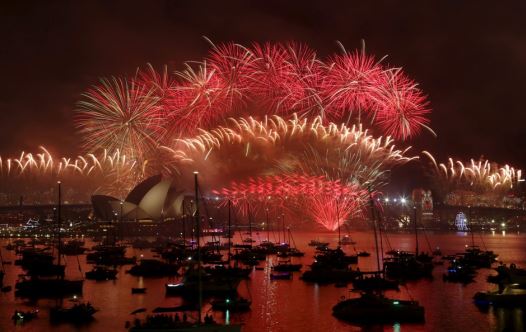 Fireworks explode over the Sydney Opera House and Harbour Bridge