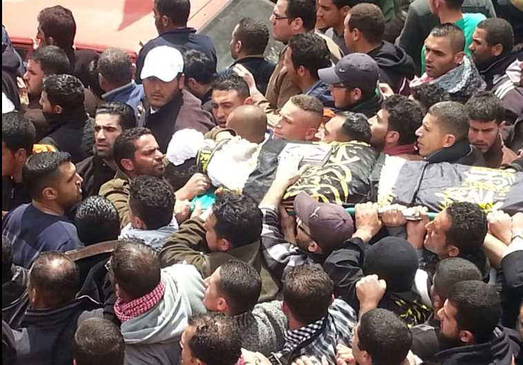 Palestinians take part in a funeral procession for an Islamic Jihad man