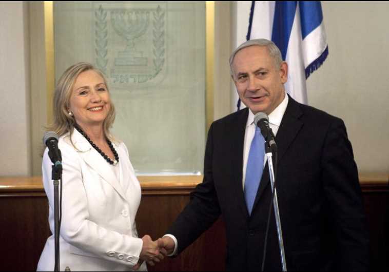 Prime Minister Benjamin Netanyahu (R) and then-Secretary of State Hillary Clinton shake hands 