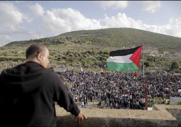 Israeli Arab demonstrators take part in a Land Day rally in the northern village of Deir Hanna