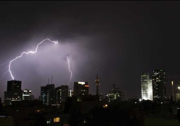 Lightning strikes over the skyline of Tel Aviv during a rain storm