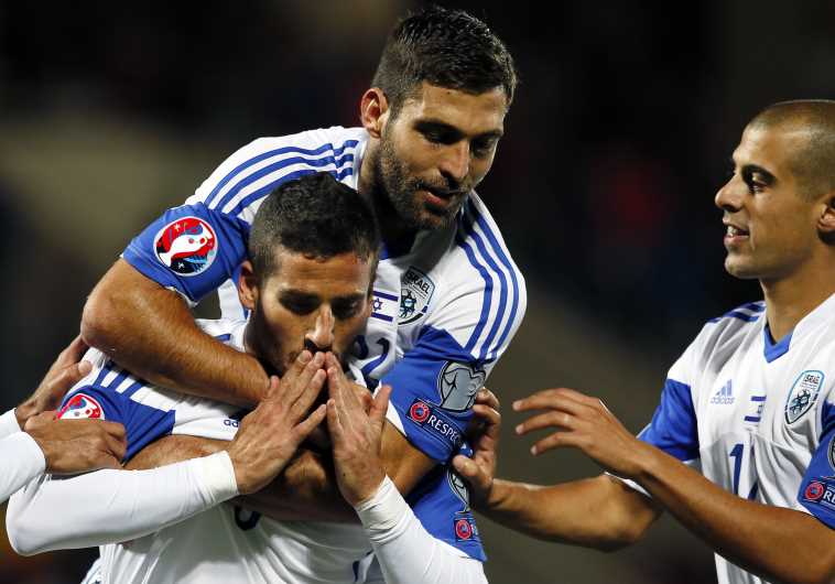 Israel's Tomer Hemed (L), Itay Shechter (C) and Tal Ben Chaim celebrate a goal against Andorra
