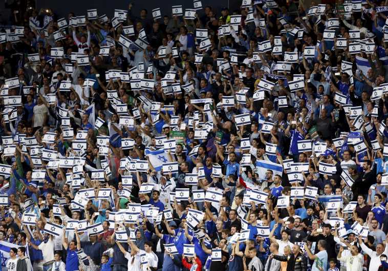 Israel fans hold placards during their Euro 2016 Group B qualifying soccer match against Wales 
