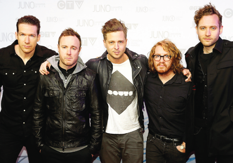 ONE REPUBLIC appears on a red carpet in Canada last year