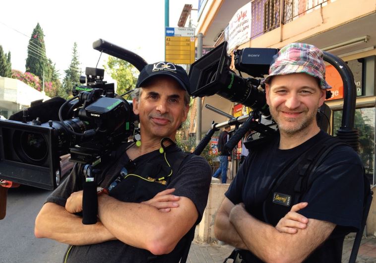 ROGER SHERMAN (left) and Anthony Savini film nearby Ma’alot Tarshiha.