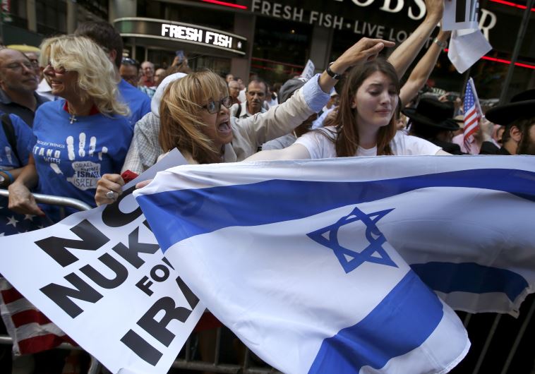 Protestors shout slogans as they demonstrate with thousands of others during a protest in New York