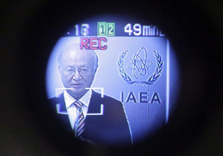 International Atomic Energy Agency (IAEA) Director-General Yukiya Amano is seen through a camera