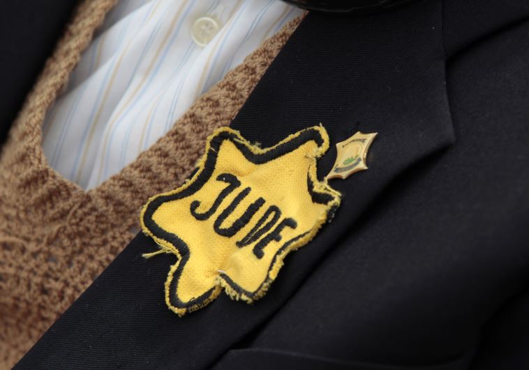 Polish born Mordechai Fox, an 89-year-old Holocaust survivor, wears a yellow Star of David
