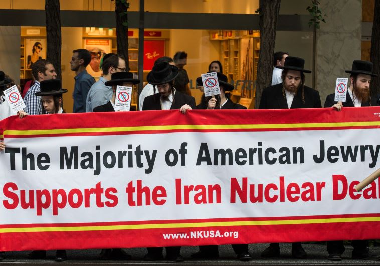 Anti-Zionist Orthodox Jews throw a counter-protest across the street from a "Stop Iran Rally"