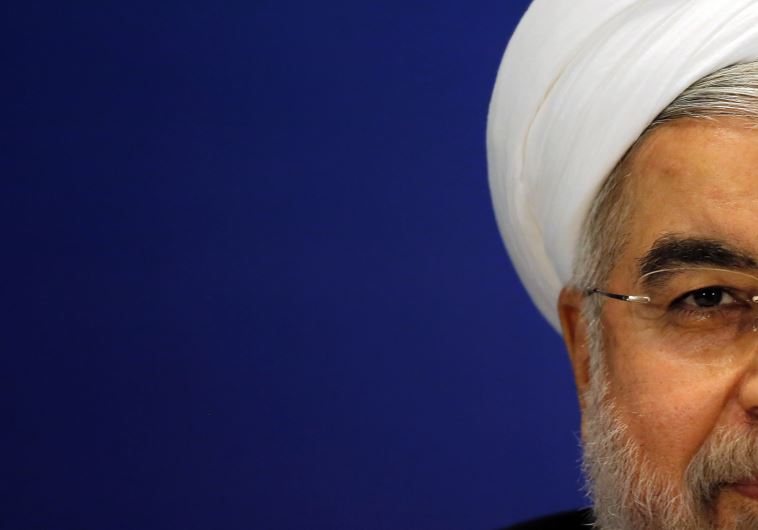 Iran's President Hassan Rouhani attends a news conference in Shanghai