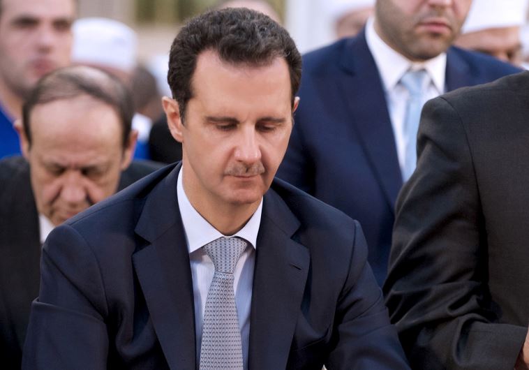 Syria's President Bashar Assad attends prayers on the first day of Eid al-Adha in Damascus