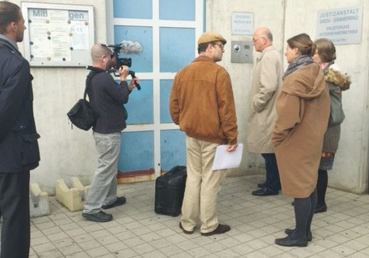 STEPHAN TEMPL (center) prepares to enter Simmering jail in Vienna